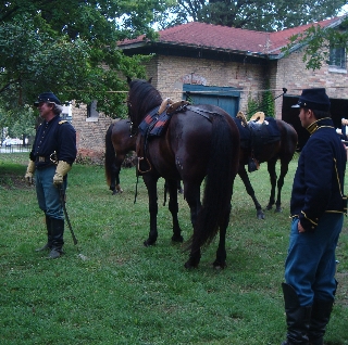 The Captain and Remington visit with guests about the mounts